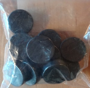 Les jetons d'Xp, semblables aux pièces d'or mais en noir